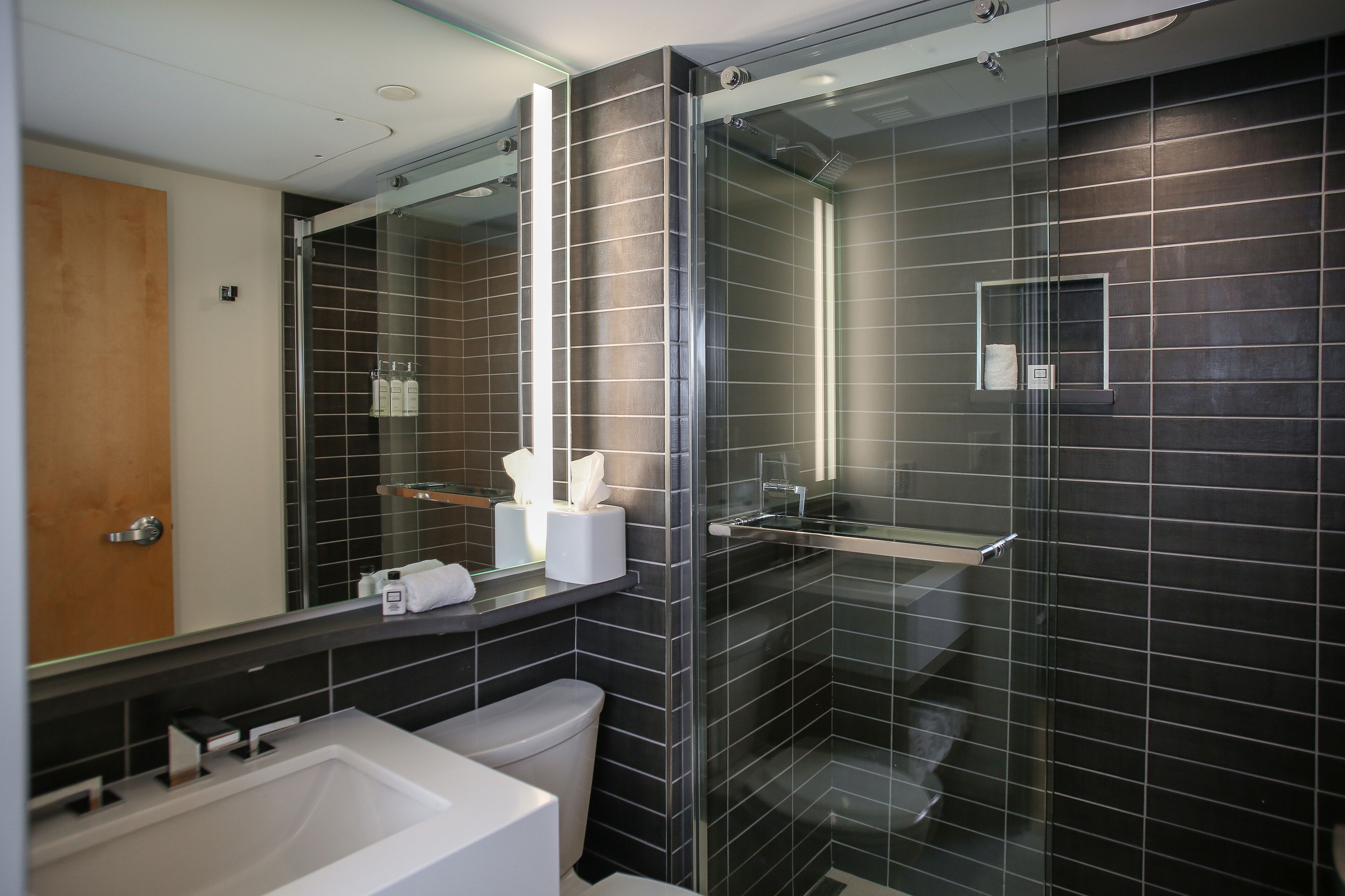 shower, designer toiletries, hair dryer, towels