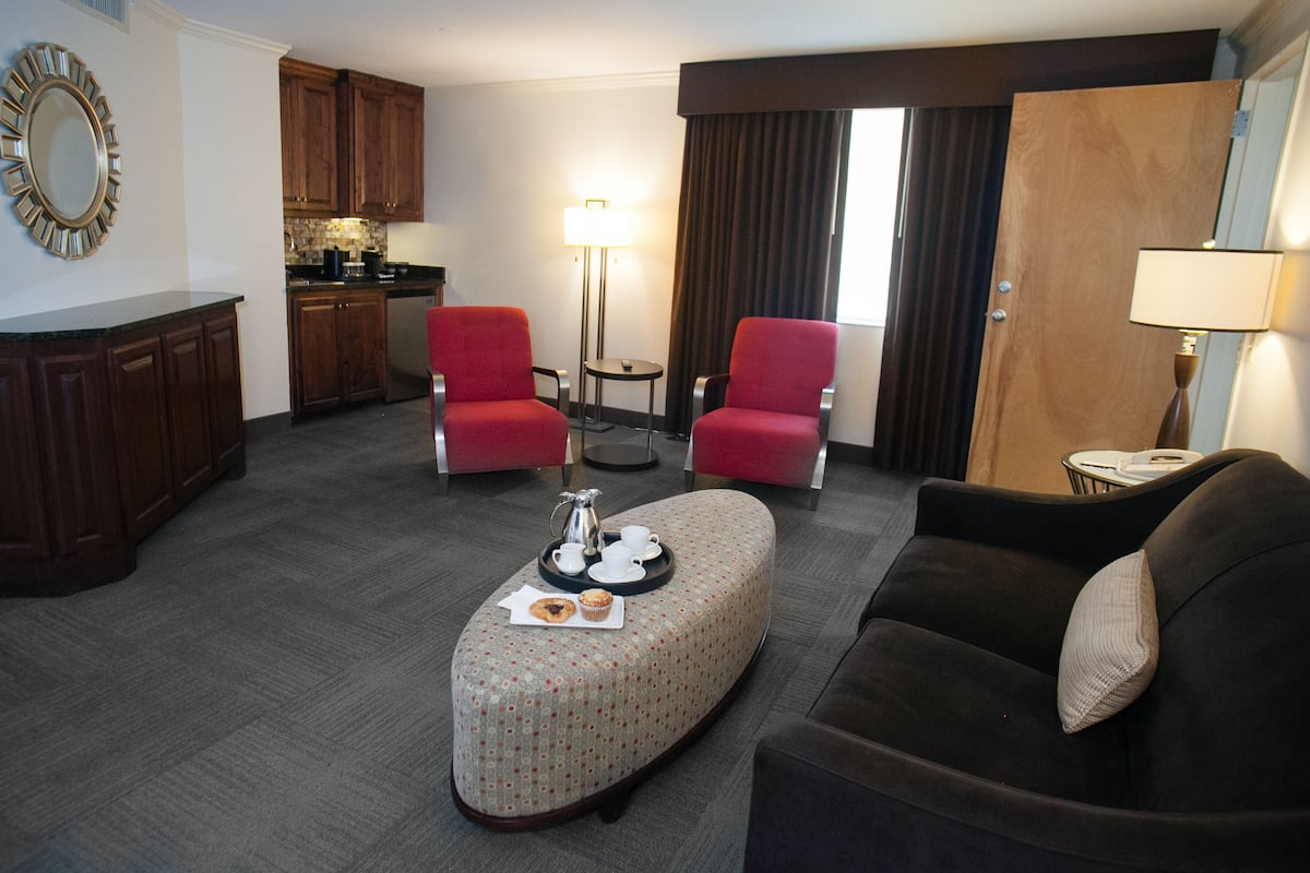 deluxe suite, 2 queen beds, refrigerator & microwave | living area | 49-inch smart tv with cable channels, tv