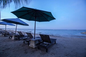 On the beach, sun loungers, beach umbrellas, beach towels