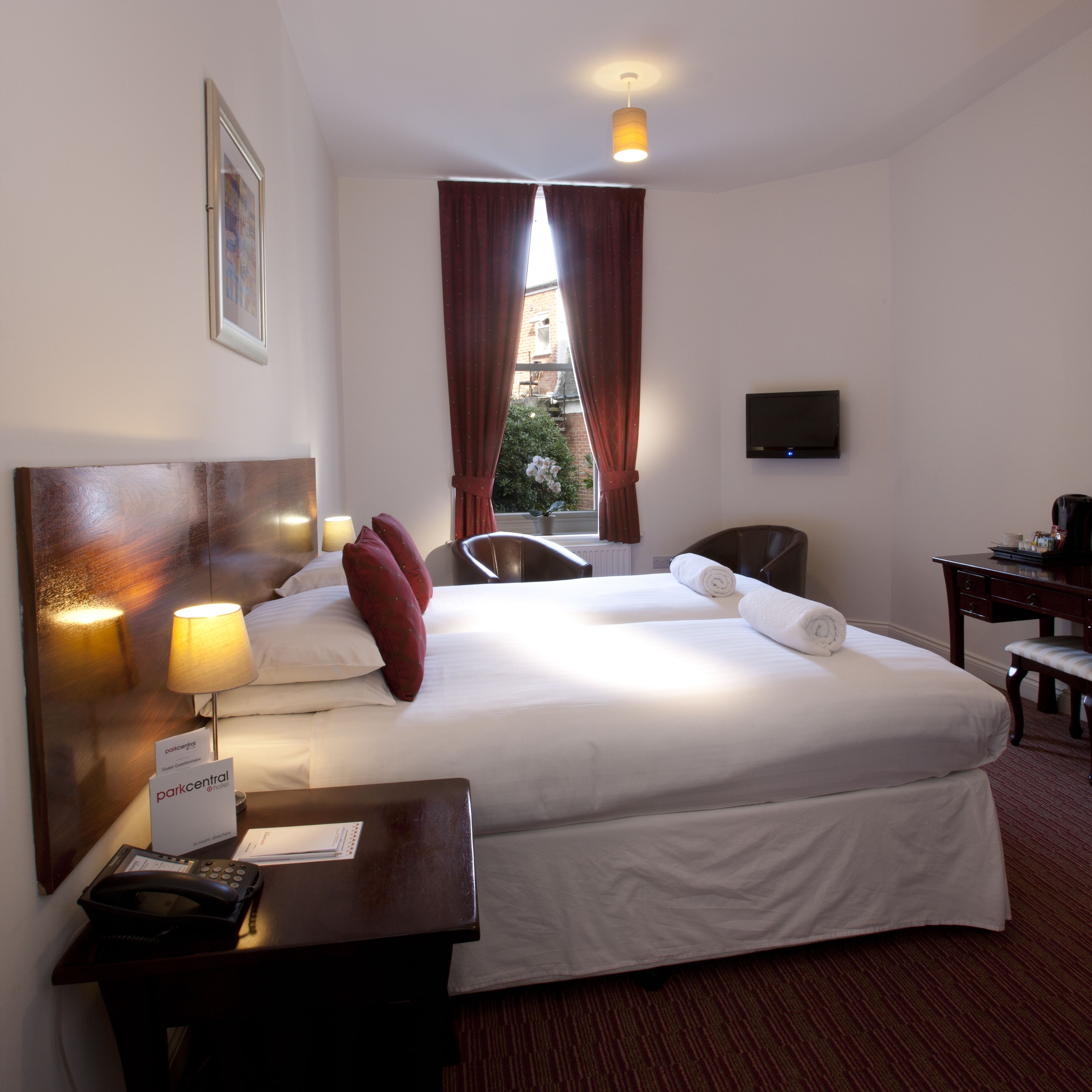 classic twin room | in-room safe, desk, blackout curtains, iron/ironing board