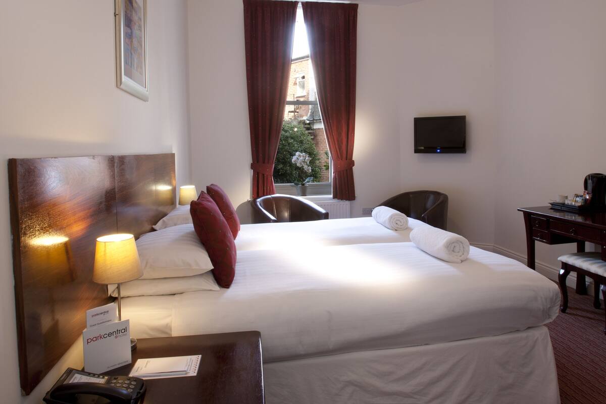 classic twin room | in-room safe, desk, blackout curtains, iron/ironing board