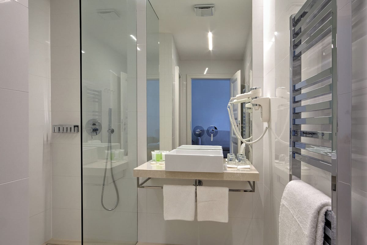 standard double room | bathroom | designer toiletries, hair dryer, towels, shampoo
