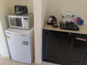 Desk, laptop workspace, blackout drapes, iron/ironing board