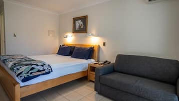 Standard Suite, 1 Bedroom, Non Smoking, Kitchenette | Desk, laptop workspace, blackout curtains, iron/ironing board