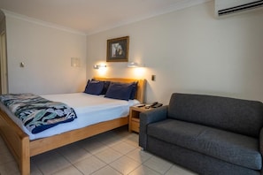 Standard Suite, 1 Bedroom, Non Smoking, Kitchenette | Desk, laptop workspace, blackout drapes, iron/ironing board