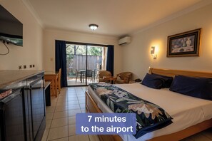 Desk, laptop workspace, blackout drapes, iron/ironing board - Novena Palms Motel (Northgate)