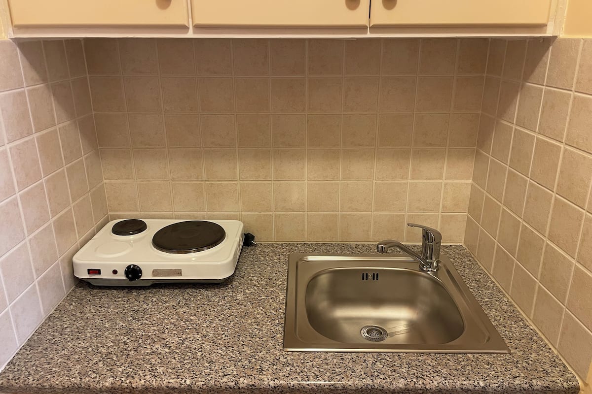 fridge, electric kettle, dining tables