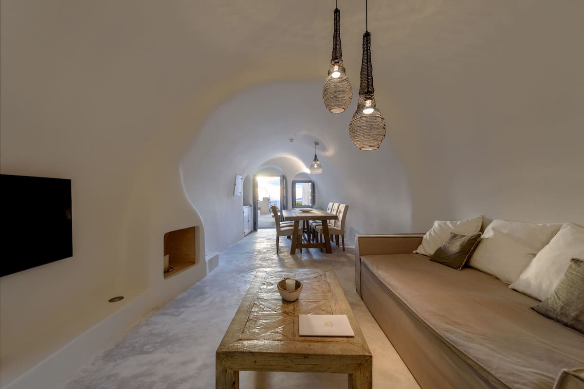 Kapari Honeymoon Suite with Private Indoor & Outdoor Hot tub | Living area | Smart TV, books