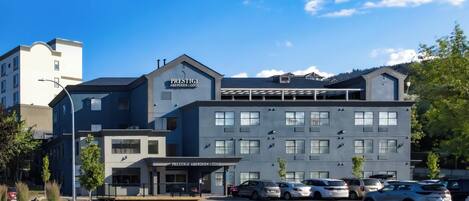 A modern hotel with a prominent sign reading "PRESTIGE ABERDEEN LODGE".