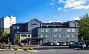 A modern hotel with a prominent sign reading "PRESTIGE ABERDEEN LODGE".