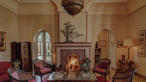 A traditional room with a fireplace, seating, and decorative elements. - Sirayane Boutique Hotel and Spa (Marrakech)