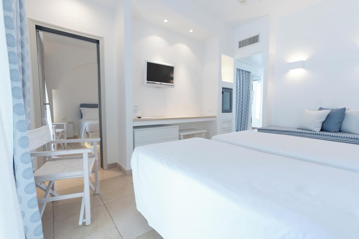 Family Room | 1 bedroom, minibar, free WiFi, bed sheets