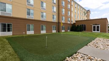 Enjoy a round of golf on the adjacent putting green, surrounded by a beautifully manicured lawn.