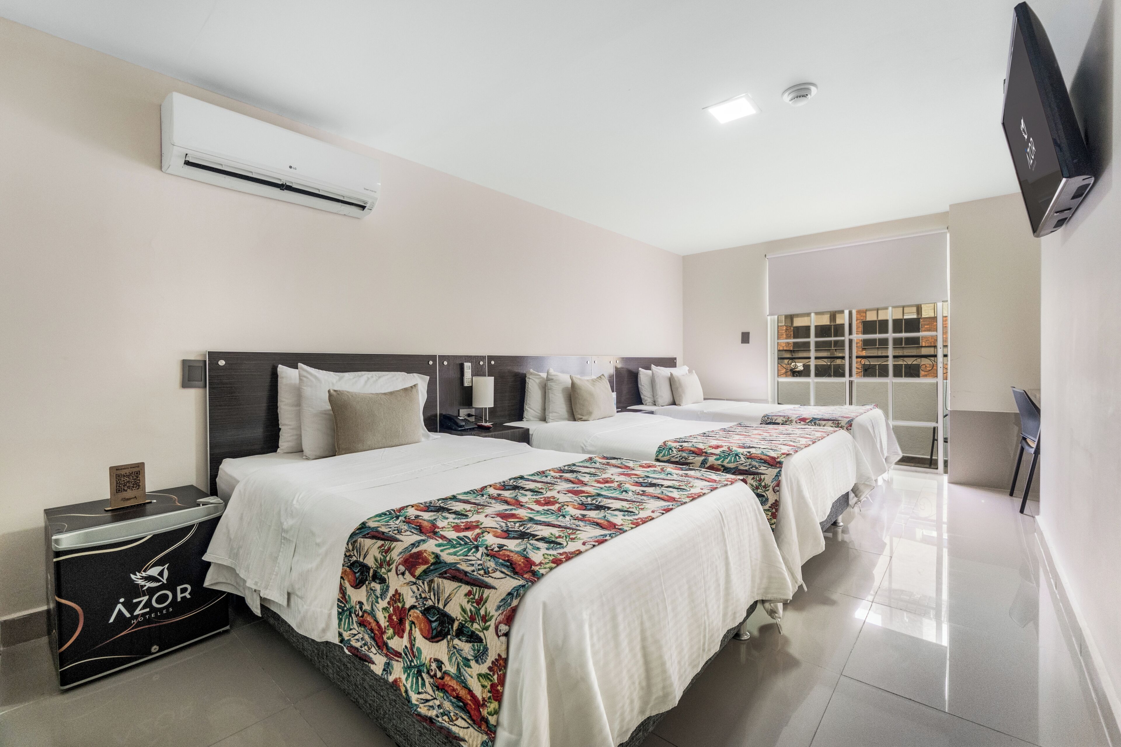 Standard Triple Room | Minibar, in-room safe, desk, blackout drapes