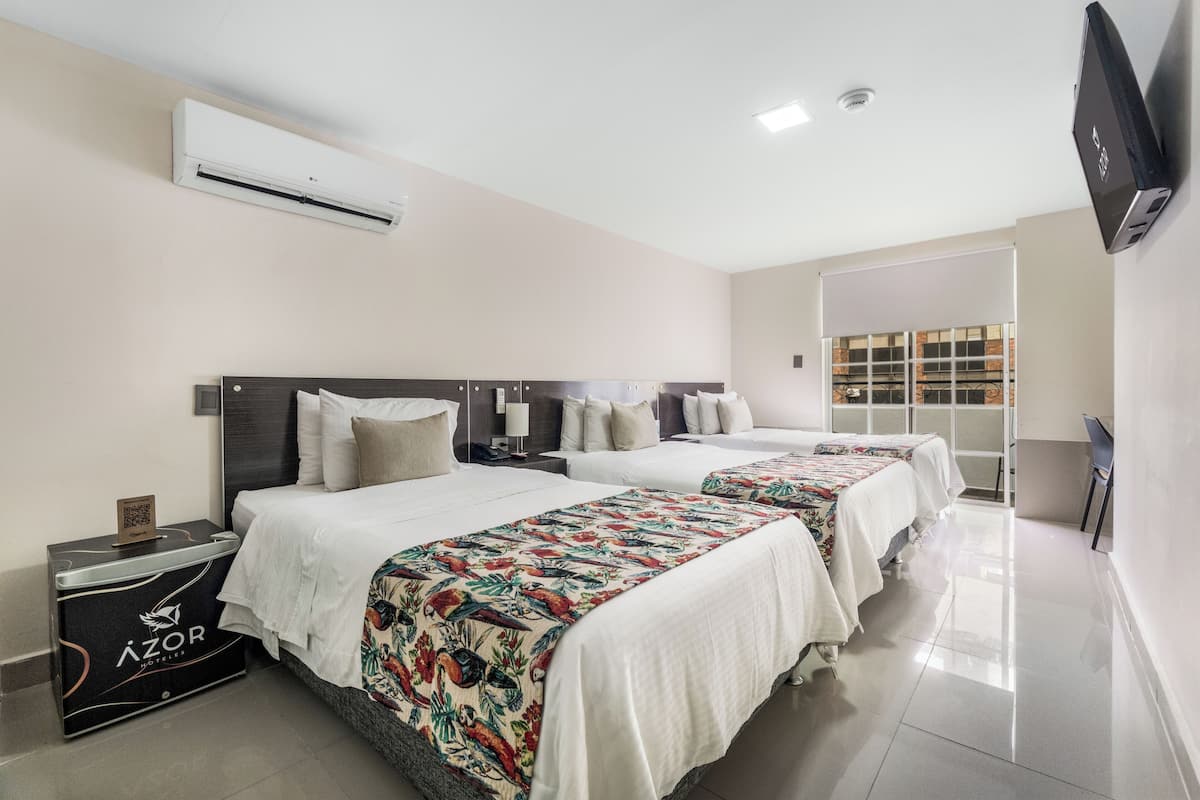 Standard Triple Room | Minibar, in-room safe, desk, blackout drapes