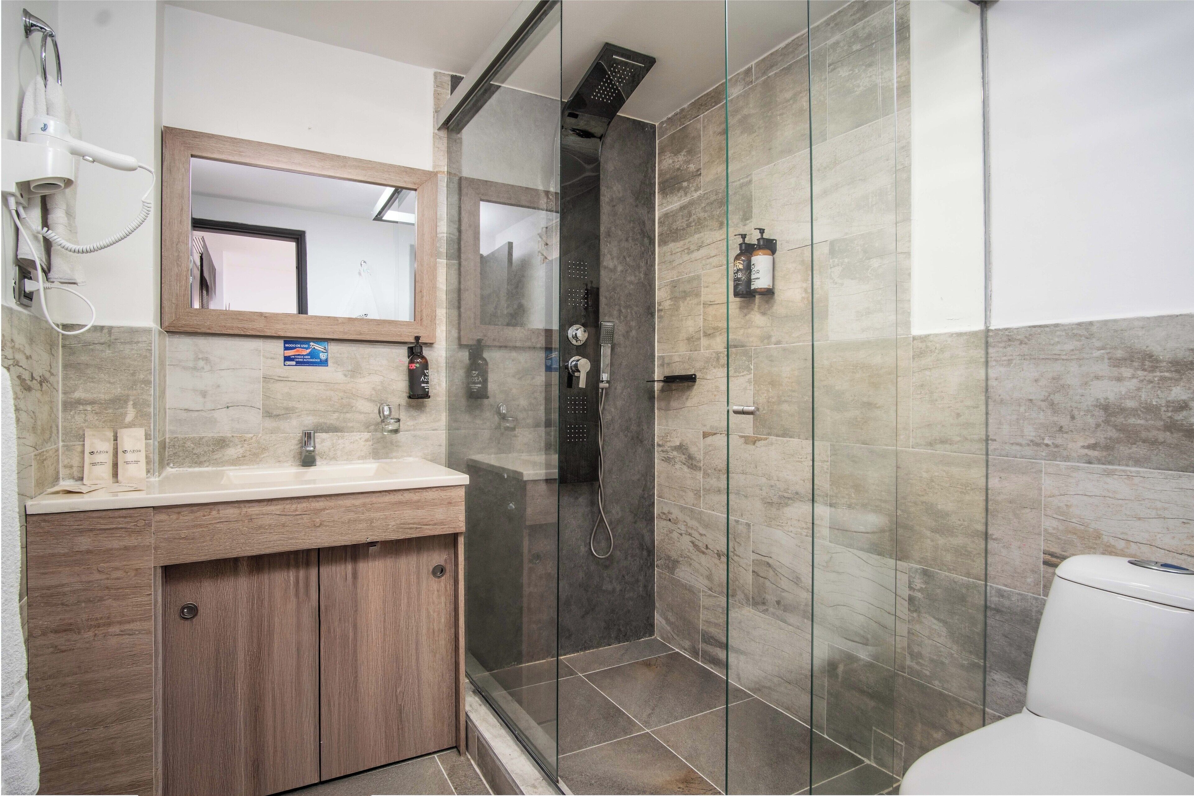 junior suite, 1 king bed, balcony | bathroom | shower, rainfall showerhead, free toiletries, hair dryer