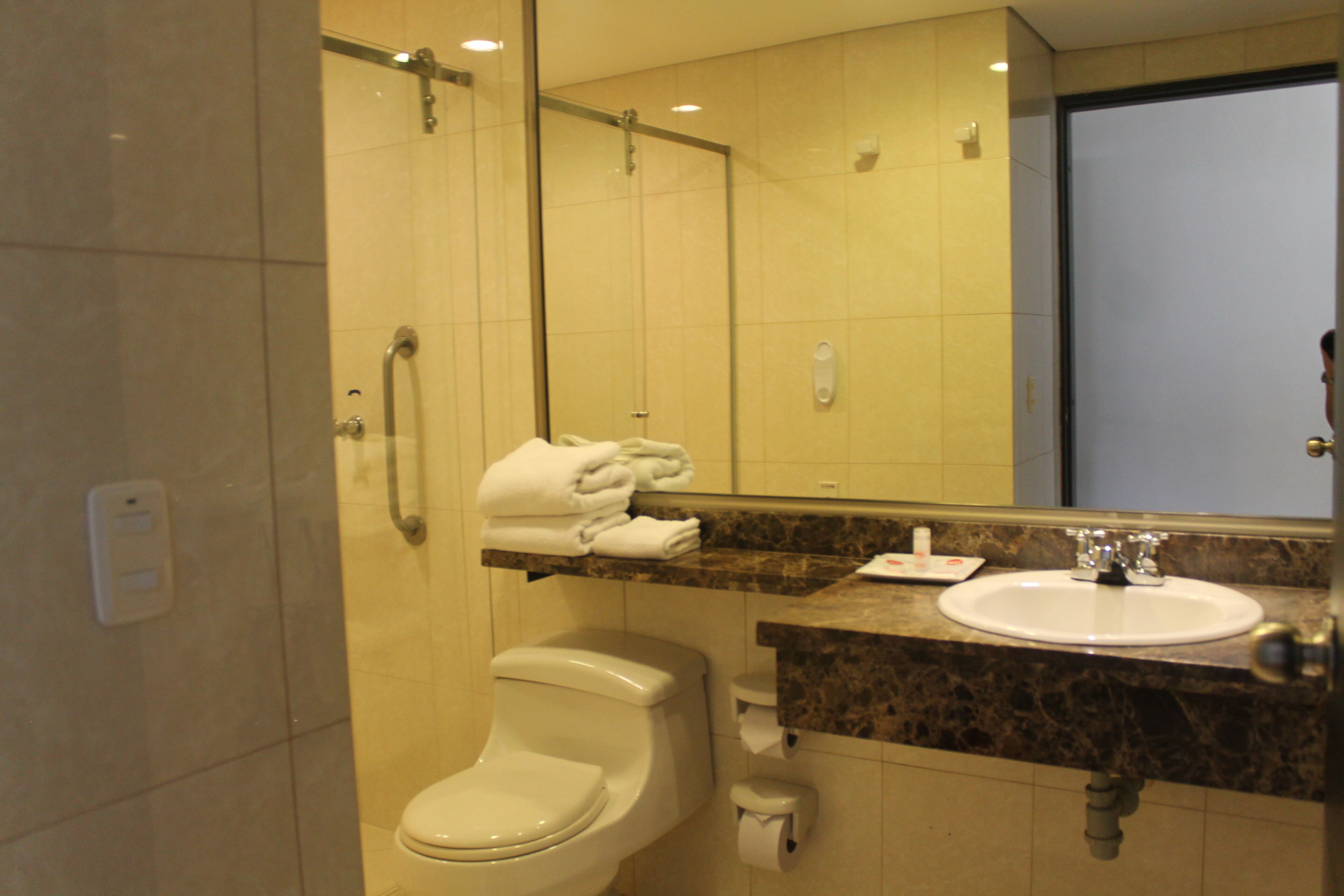 standard room, 2 double beds | bathroom | shower, rainfall showerhead, hair dryer, towels
