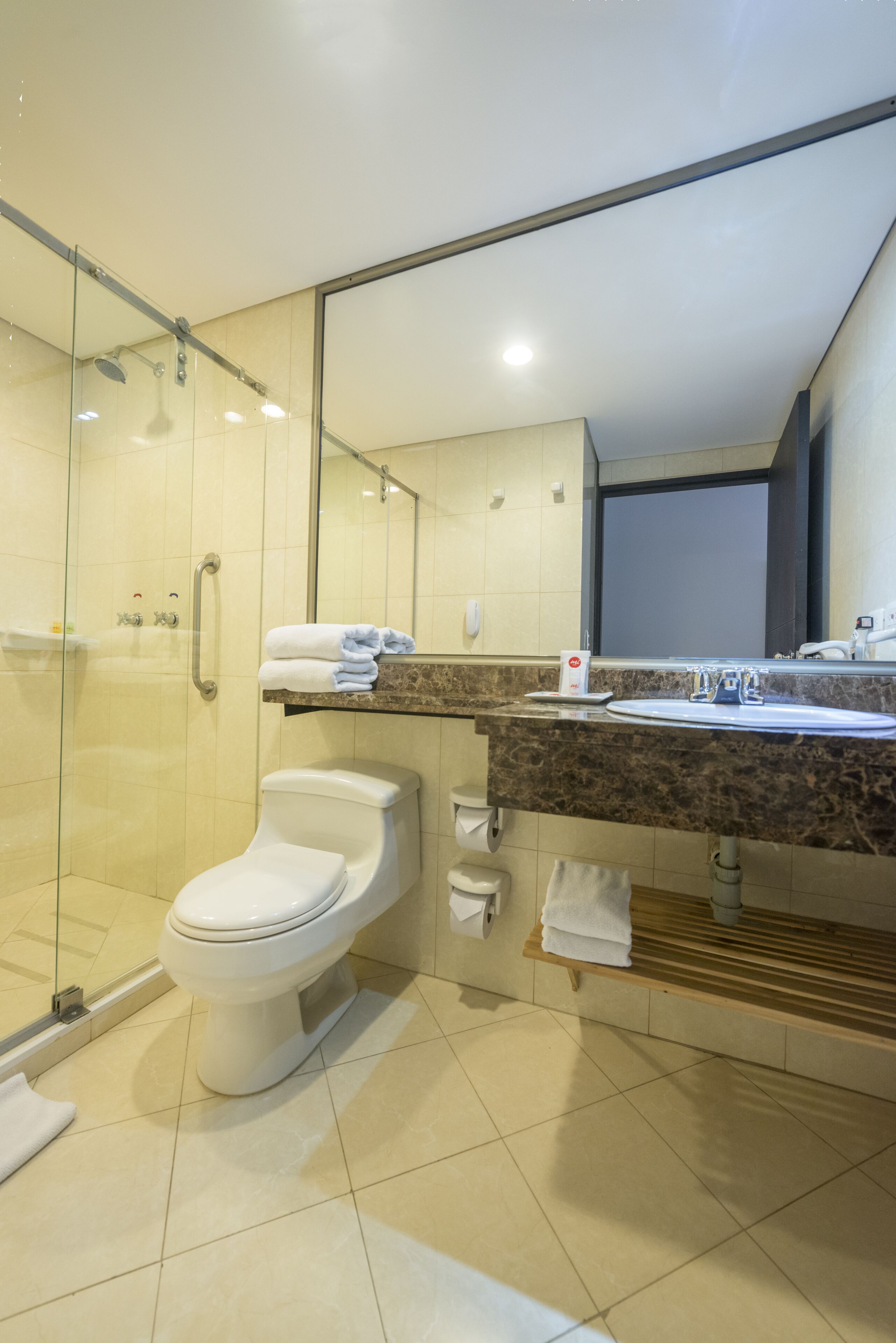 shower, rainfall showerhead, hair dryer, towels