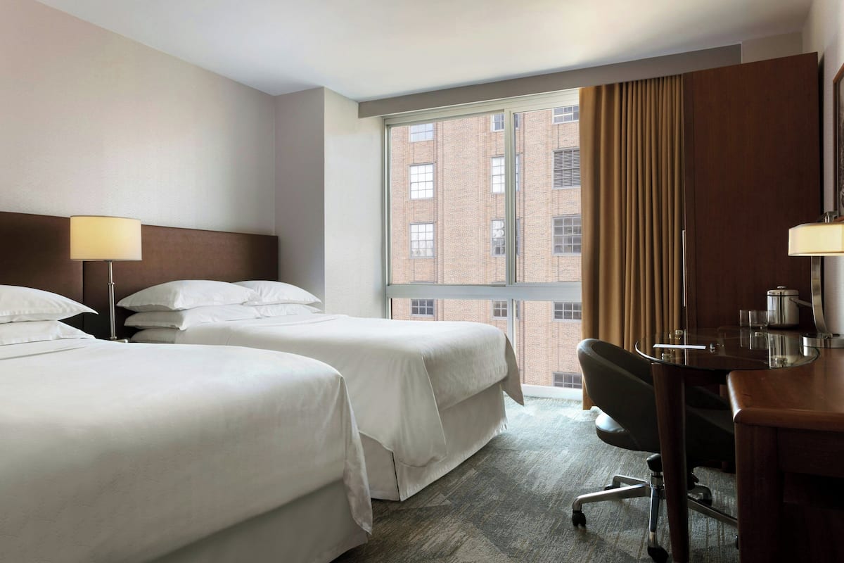 Down duvets, pillow-top beds, in-room safe, desk