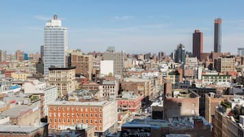 A cityscape with a variety of building styles, including modern skyscrapers and older, brick buildings.