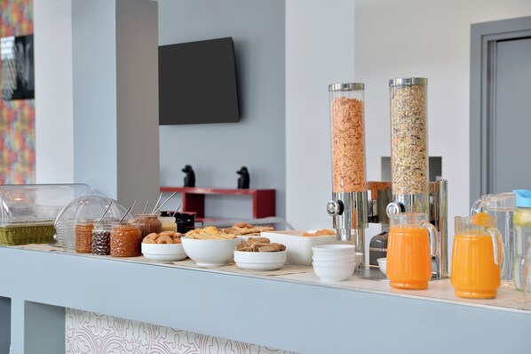 A breakfast buffet with various food items and a coffee machine. - Patras Smart Hotel, Vassilicos House of Hospitality (Patras)