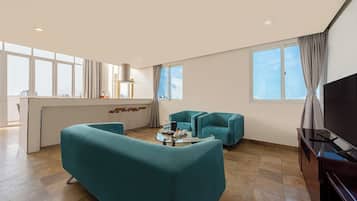 Family Suite | Living area | 32-inch TV with cable channels