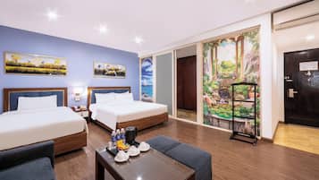 Deluxe Suite Triple | Minibar, in-room safe, blackout drapes, iron/ironing board