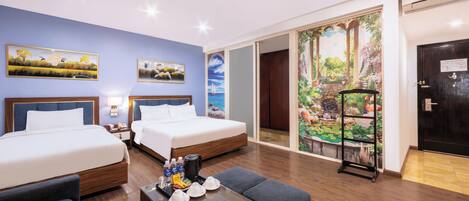 Deluxe Suite Triple | Minibar, in-room safe, blackout drapes, iron/ironing board