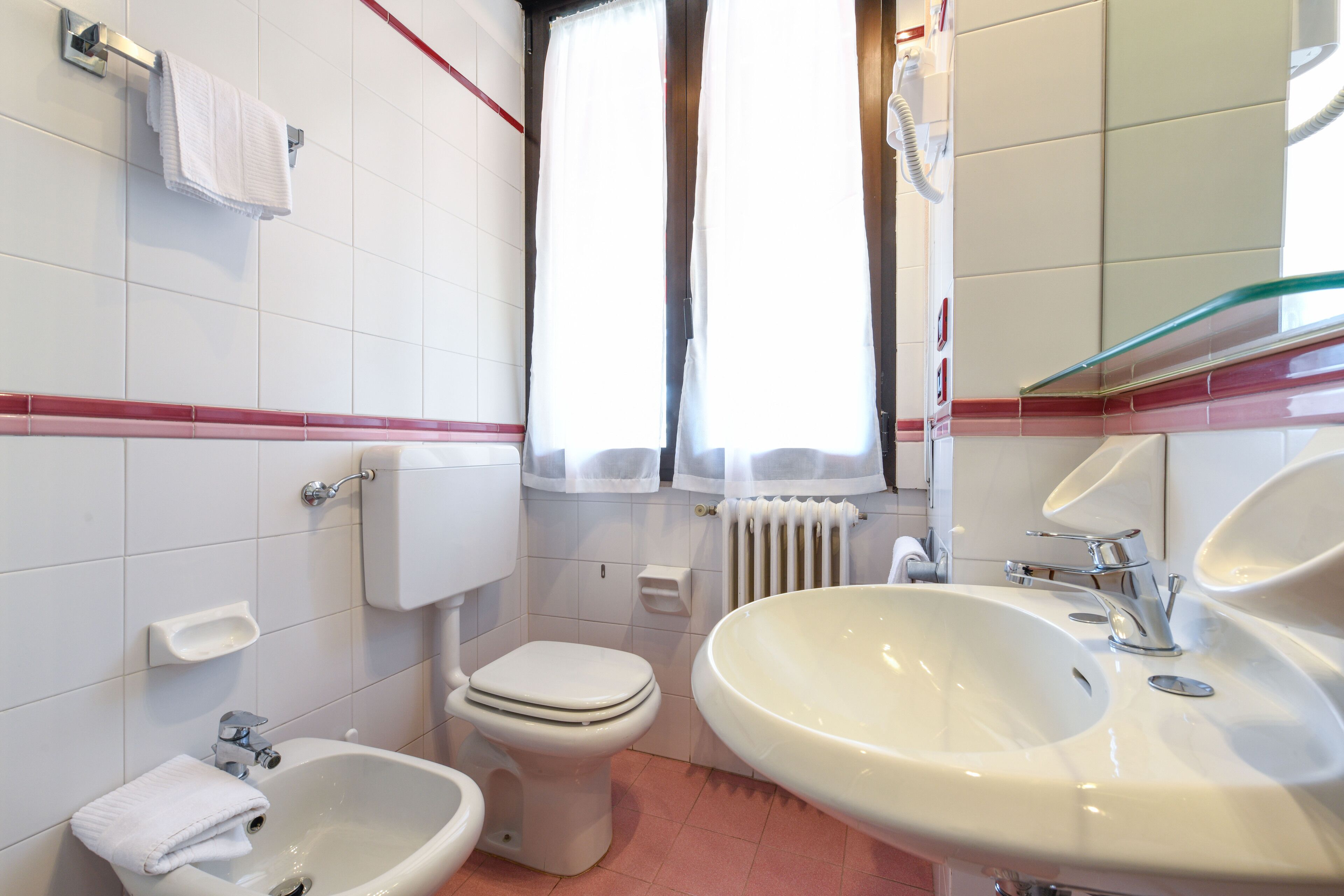 economy room | bathroom | shower, free toiletries, hair dryer, bathrobes