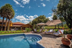 Seasonal outdoor pool, open 7:00 AM to 4:30 PM, pool umbrellas