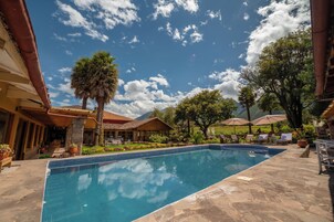 Seasonal outdoor pool, open 7:00 AM to 4:30 PM, pool umbrellas