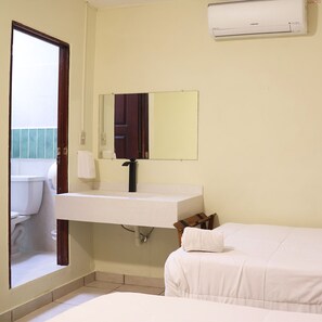 Family Room | Down duvets, in-room safe, desk, iron/ironing board - Morrison Hotel San Salvador (San Salvador)