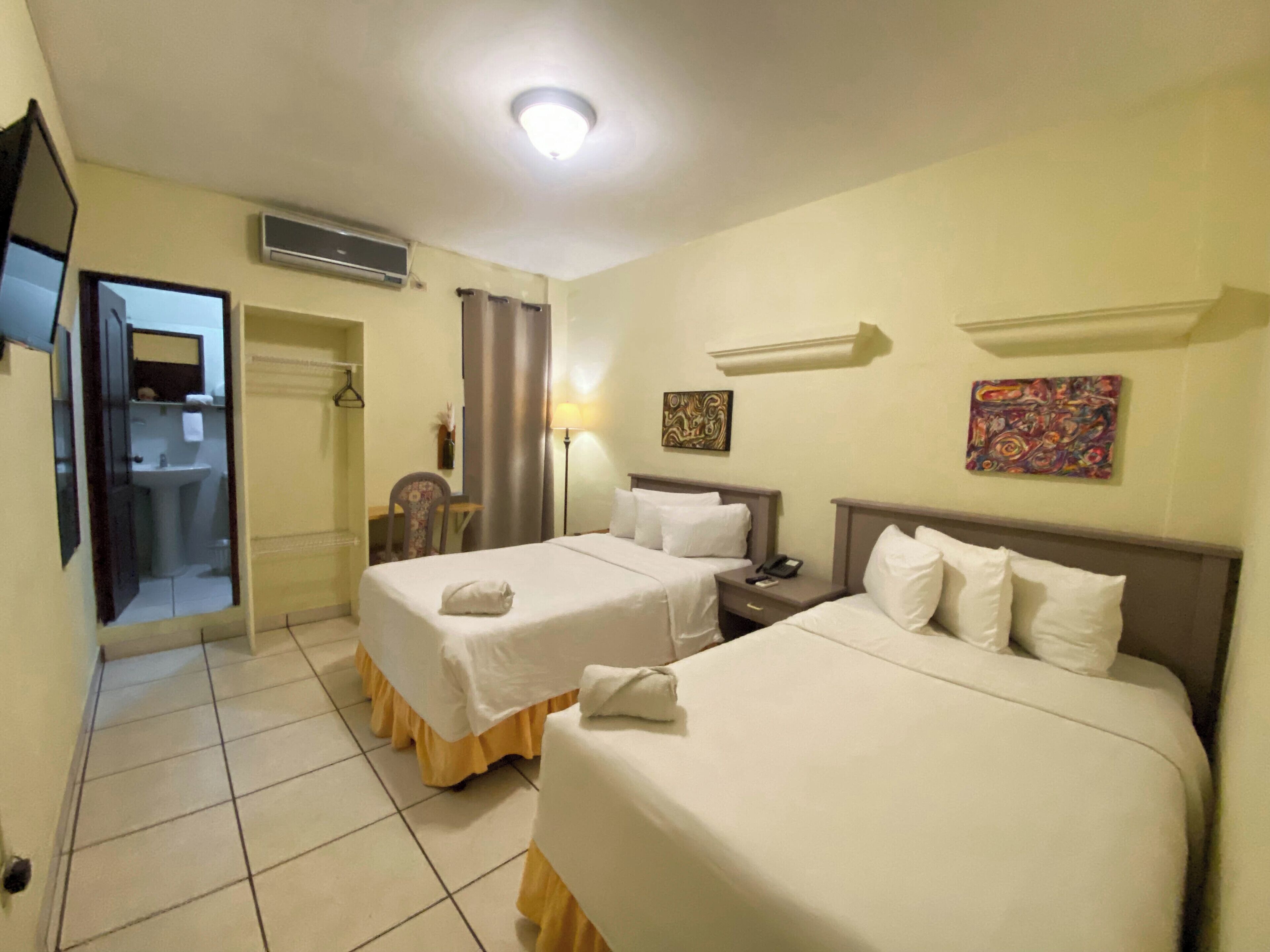 standard double room, 2 double beds | 1 bedroom, down duvets, in-room safe, desk