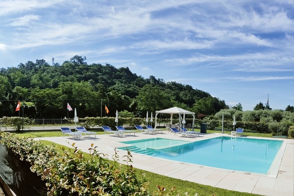 Seasonal outdoor pool, open 7:30 AM to 8:00 PM, pool umbrellas