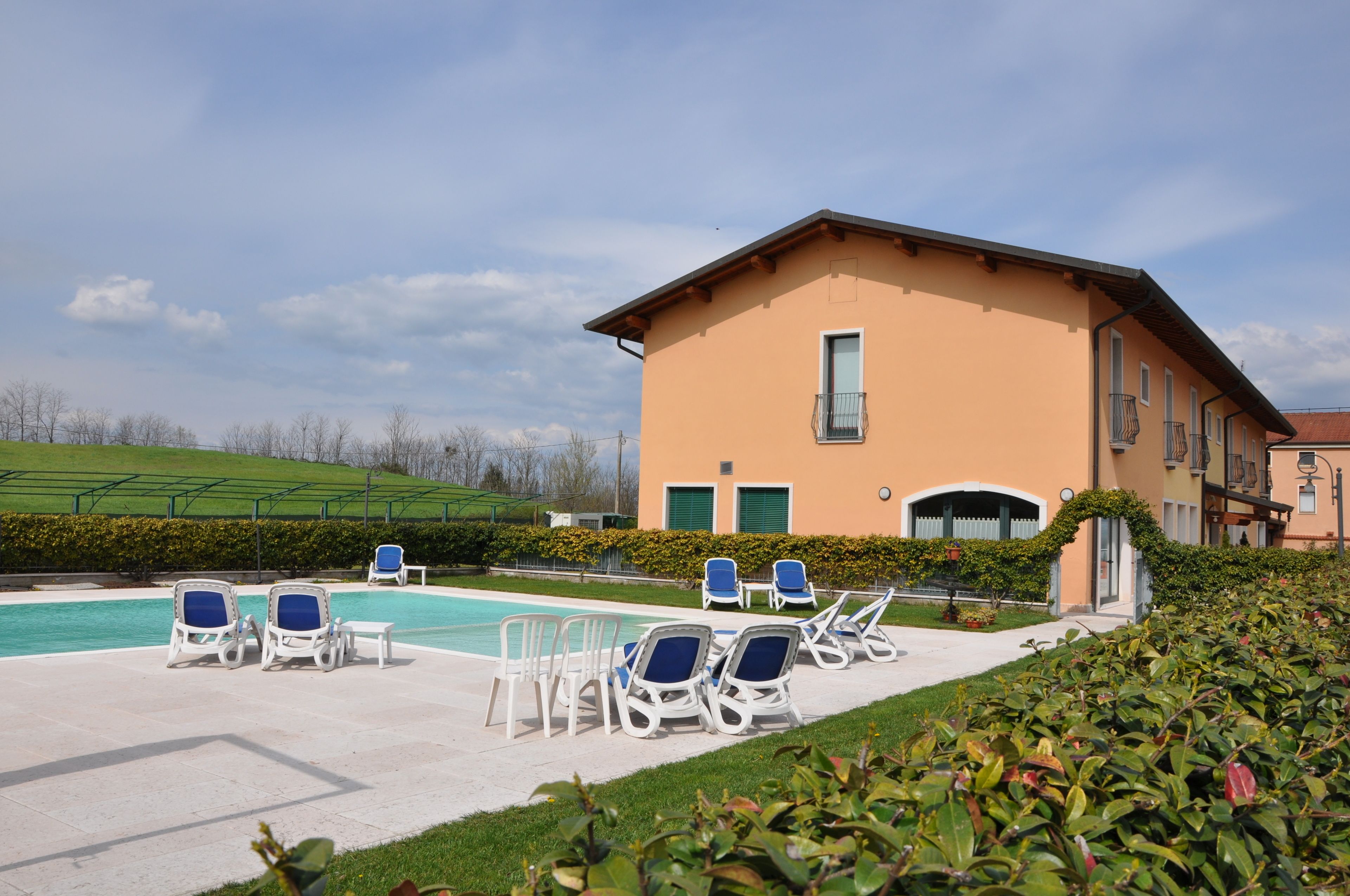 seasonal outdoor pool, pool umbrellas, pool loungers