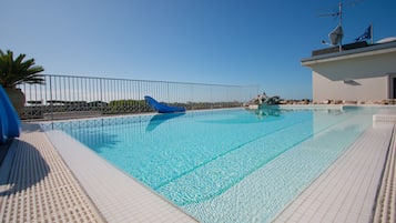 Outdoor pool, open 8:00 AM to 8:00 PM, sun loungers