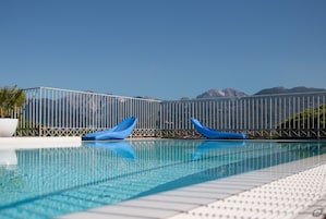 Outdoor pool, open 8:00 AM to 8:00 PM, sun loungers