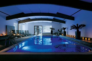 Indoor pool, open 8:00 AM to 9:00 PM, pool loungers