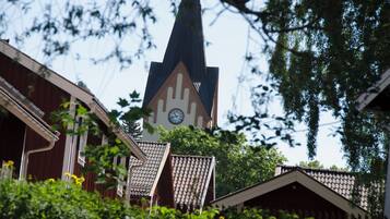 A church with a clock tower and a steeple.