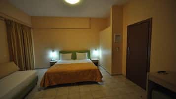 A hotel room with a bed, bedside tables, a desk, a wardrobe, and a curtain.
