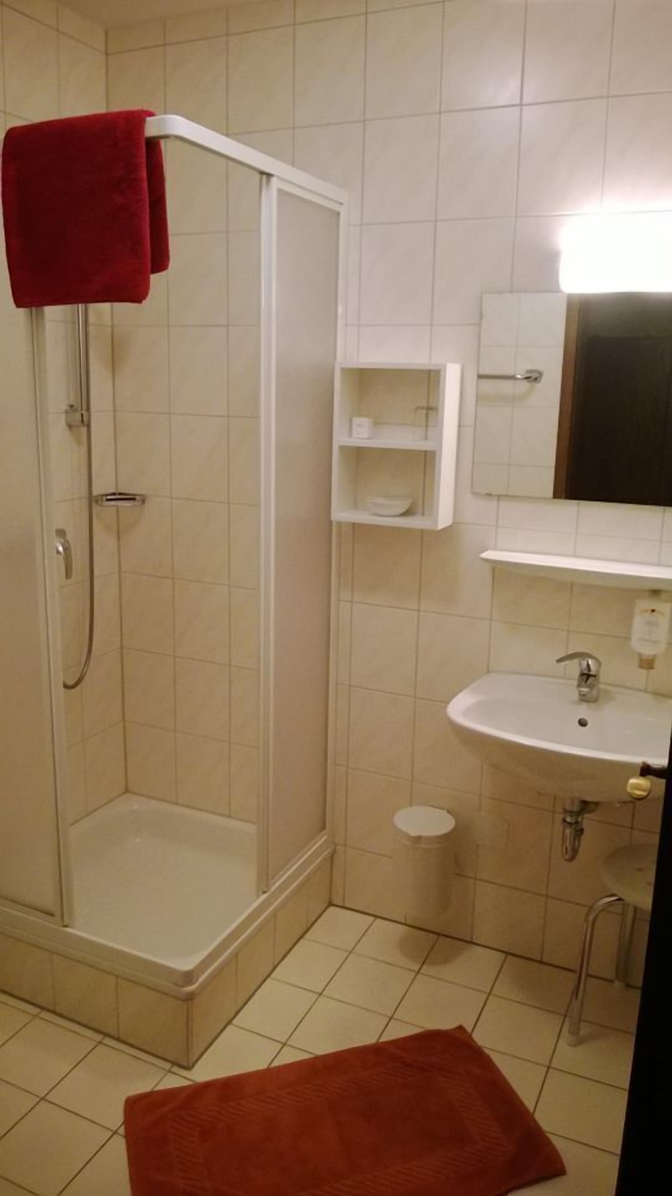 shower, hair dryer, dressing gowns, towels