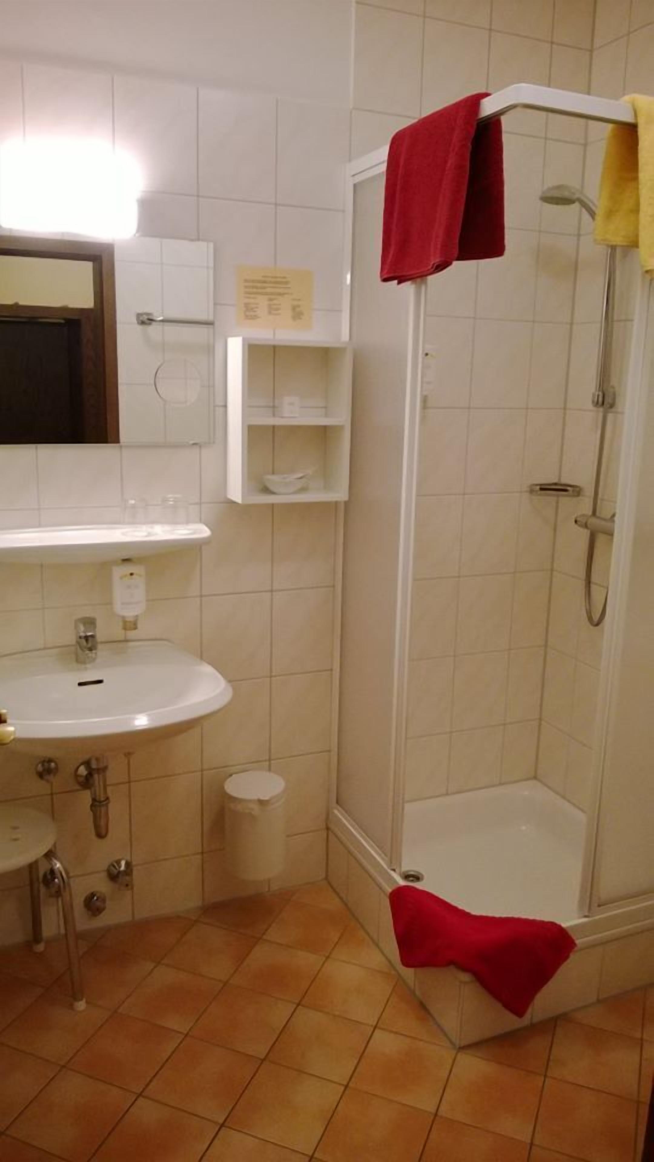 shower, hair dryer, dressing gowns, towels