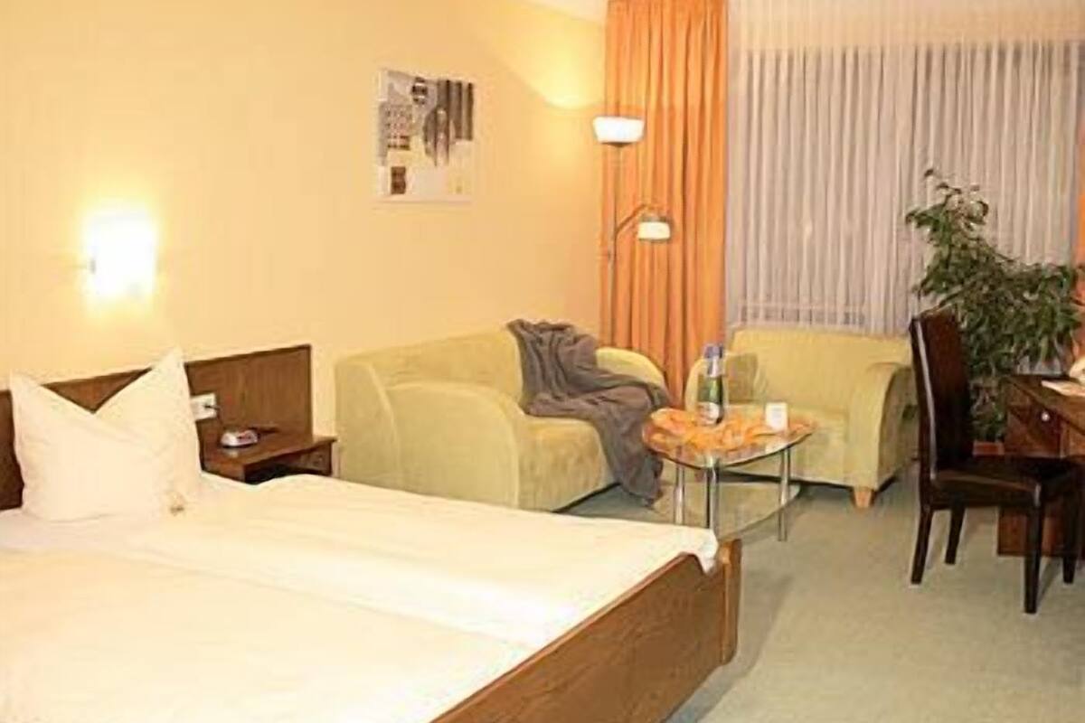 junior suite | in-room safe, desk, laptop workspace, iron/ironing board