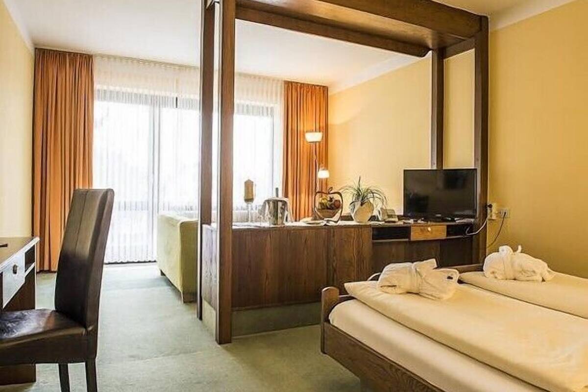 superior suite | in-room safe, desk, laptop workspace, iron/ironing board