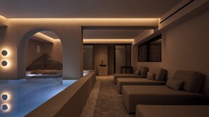 A modern spa area with a pool, seating, and a sauna. - Uzenie All Suites Boutique Resort - Adults Only (Rethymno)