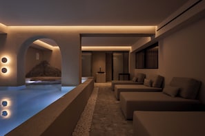 A modern spa area with a pool, seating, and a sauna. - Uzenie All Suites Boutique Resort - Adults Only (Rethymno)