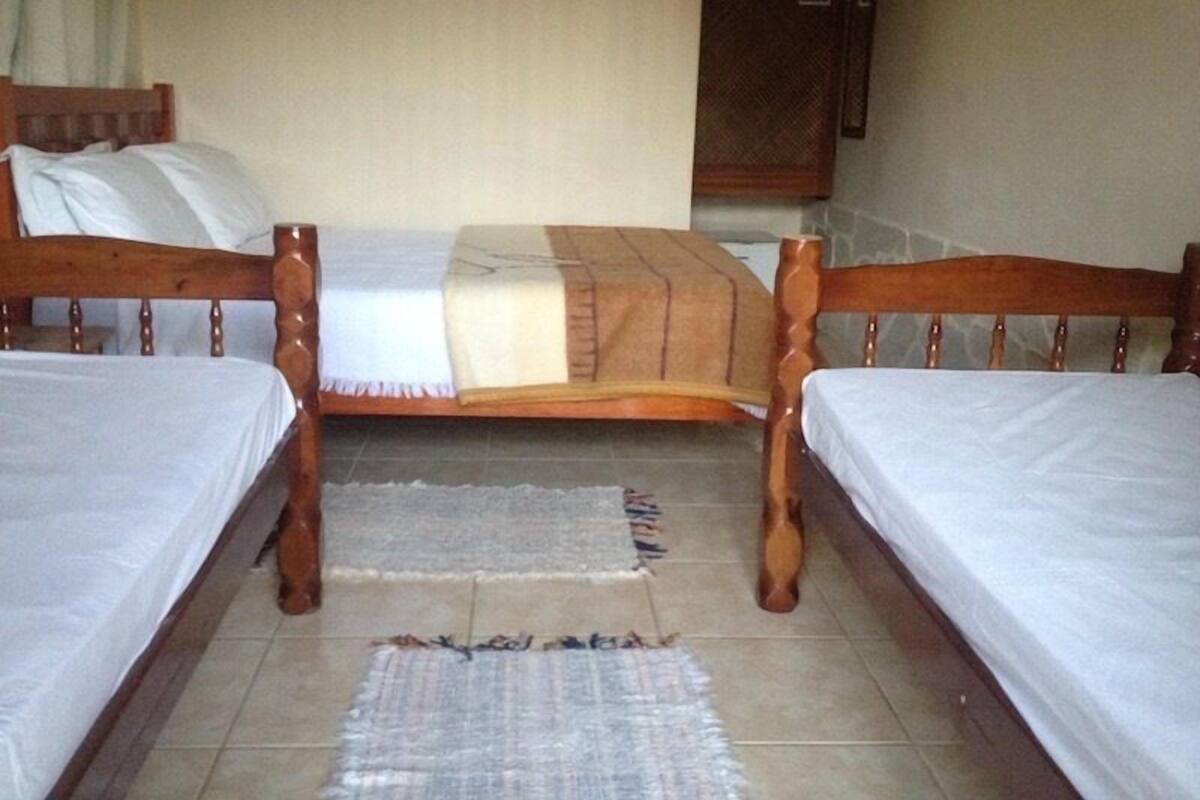 Suite Quadrupla Terrea Com Vista Mar | Minibar, in-room safe, blackout curtains, rollaway beds