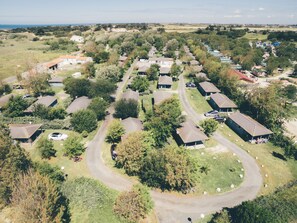 An aerial view of a residential area with houses, roads, and greenery. - Terres de France - Hameaux des Marines (Saint-Denis-d'Oleron)