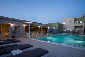 Seasonal outdoor pool, open 9:00 AM to 7:30 PM, pool umbrellas