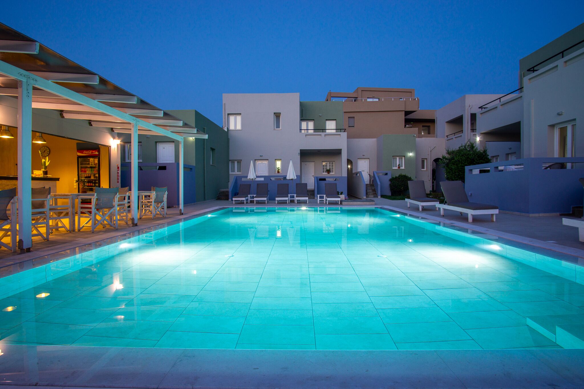 Seasonal outdoor pool, open 9:00 AM to 7:30 PM, pool umbrellas